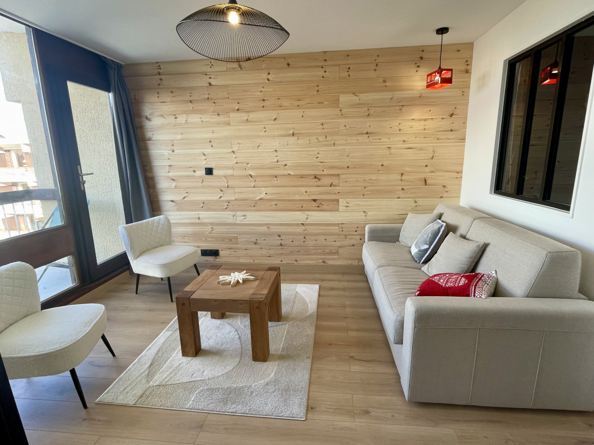 Salon avec canapé lit